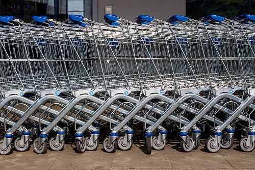 in front of a supermarket shopping carts are ready for customers